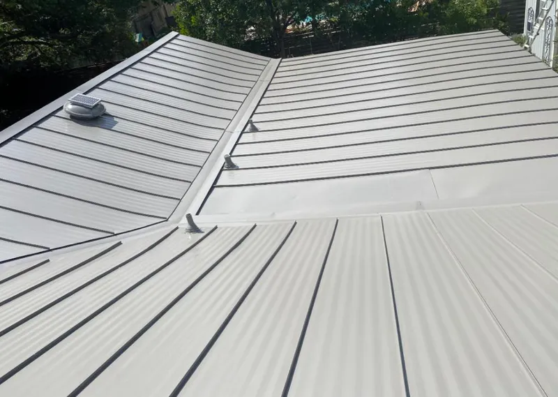 Solar attic fan installed on a metal roof for Roof Ventilation in Wichita